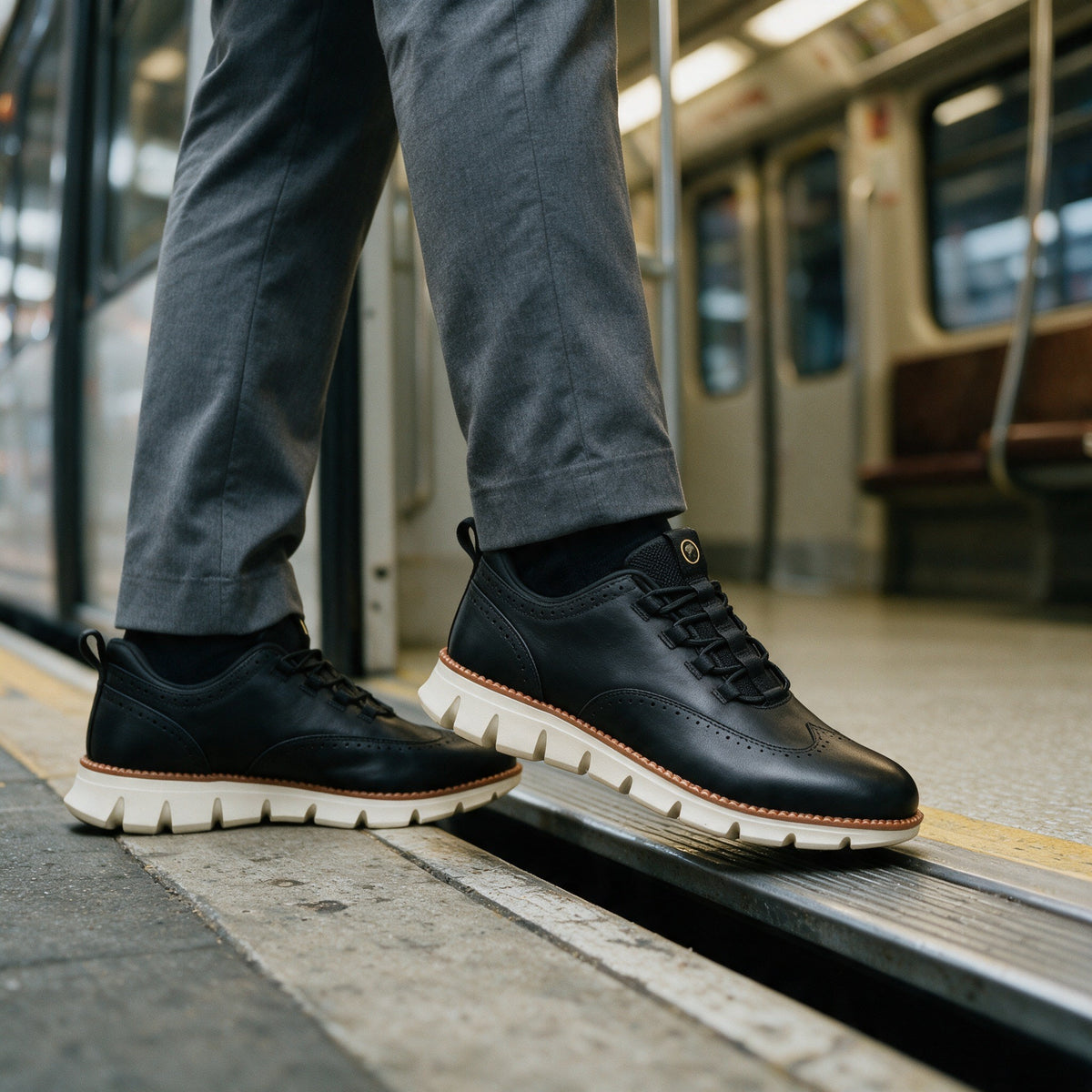 Black brogue sneakers stepping onto a train
