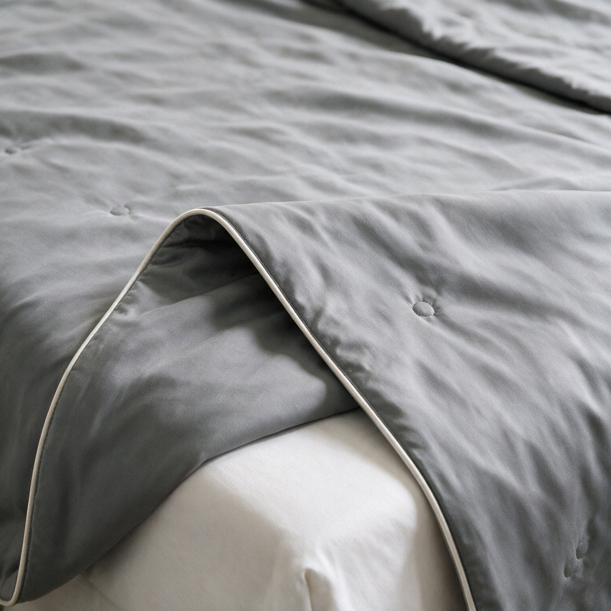 Seaton duvet corner turned back in Grey, same smooth face on both sides
