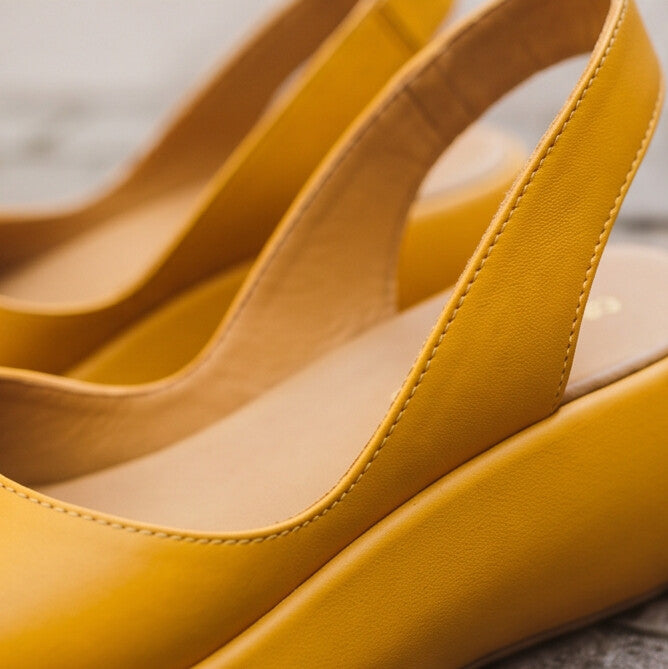 2. A footbed that moves with your arch — not a rigid orthopedic bump