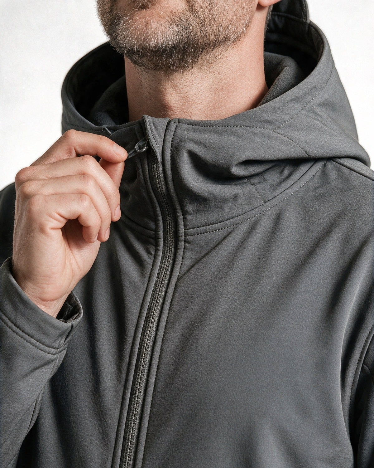 Braddock high collar, front zip and hood drawcord, close-up