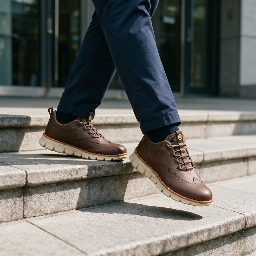 Brown brogue sneakers on a stone step