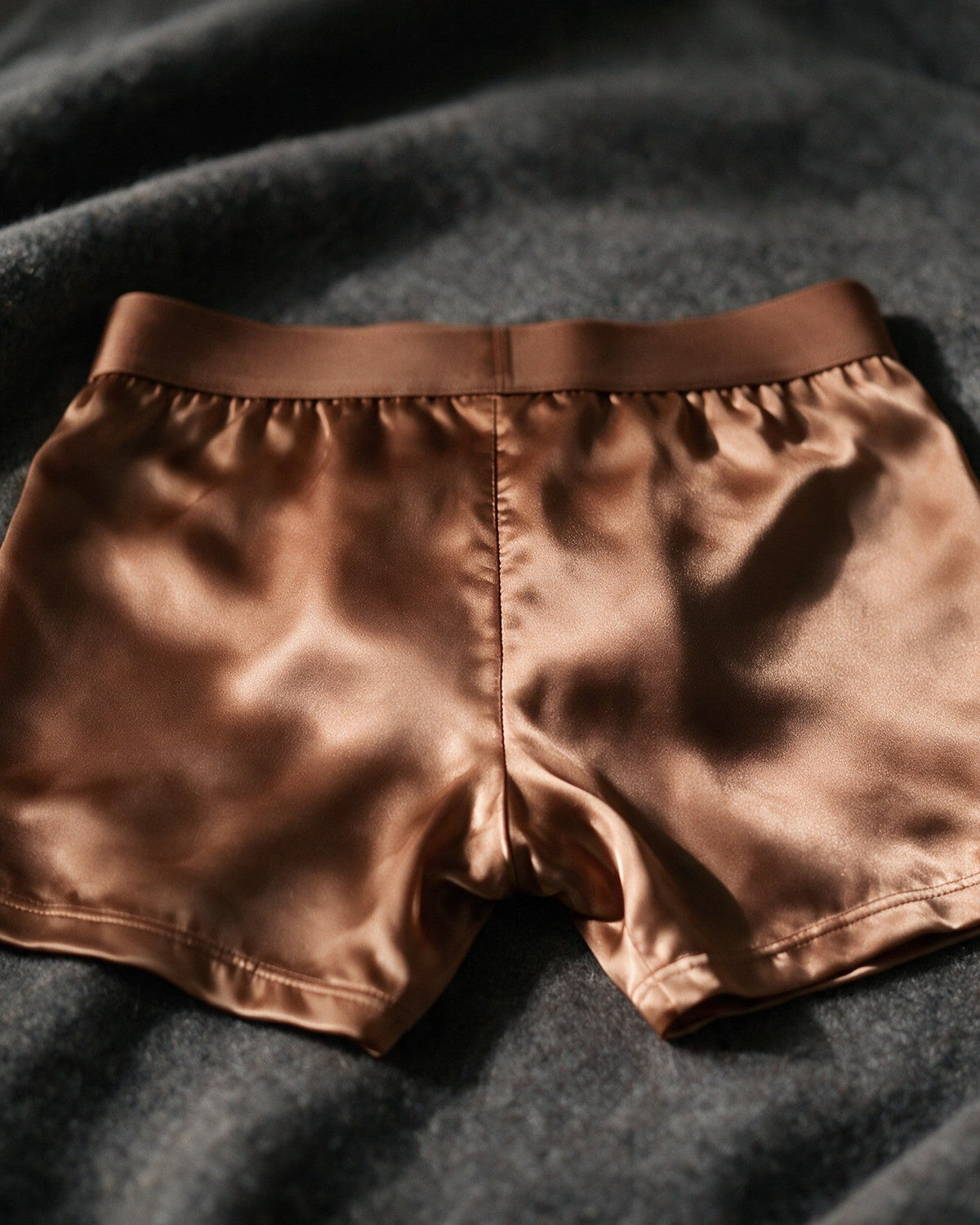 Mayfair men's silk-blend boxer in Bronze, back view in raking light