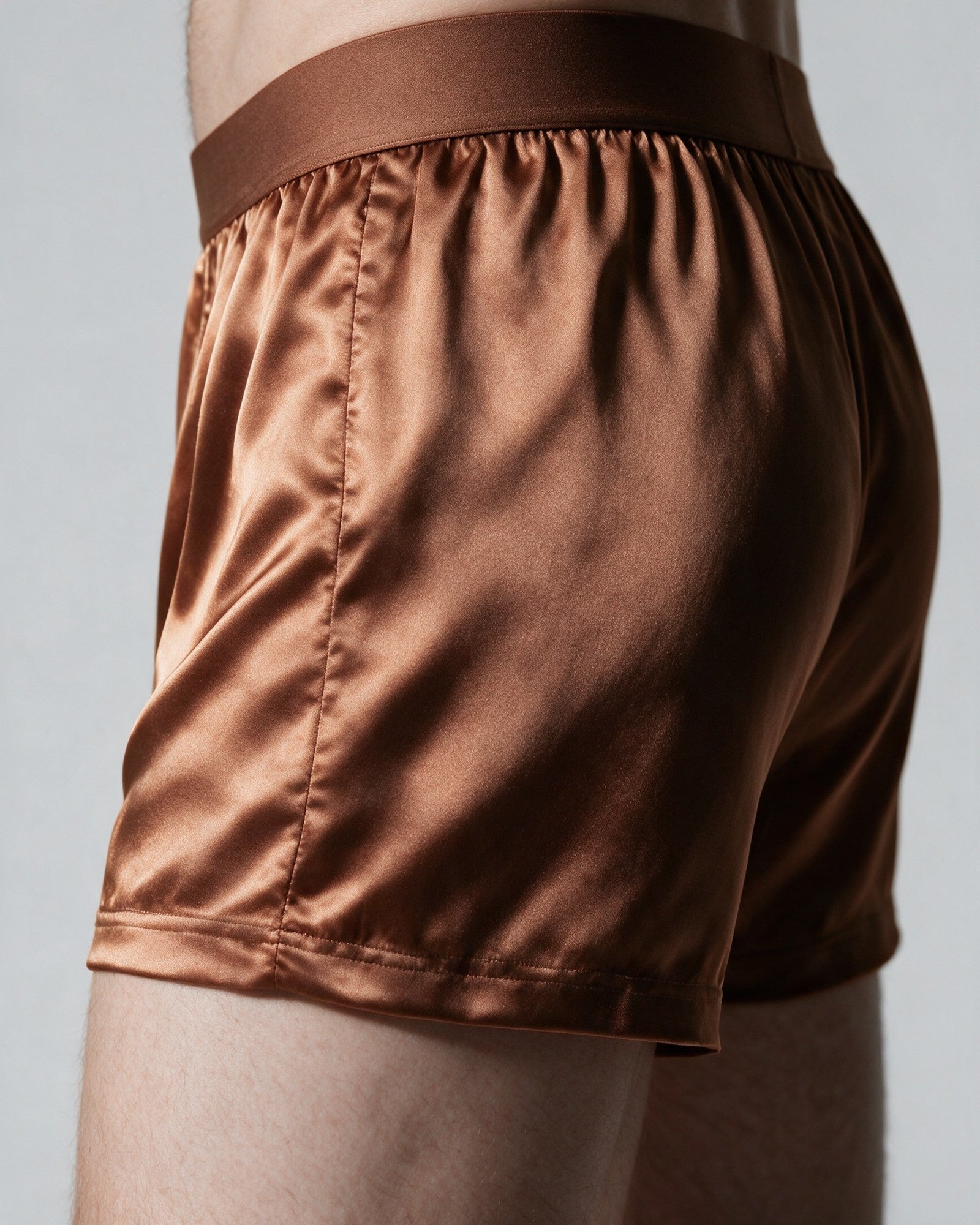 Side of the Mayfair silk-blend boxer in Bronze, showing the short leg and clean hem